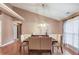 Dining room with hardwood floors, pendant lighting, and wainscoting at 4235 Crestwood Bend Cir, Buford, GA 30518