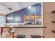 Eat-in kitchen featuring hardwood floors, stainless appliances, and an eat-up breakfast bar at 4235 Crestwood Bend Cir, Buford, GA 30518