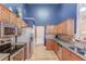 Kitchen with granite countertops, stainless steel appliances, tile backsplash, and hardwood floors at 4235 Crestwood Bend Cir, Buford, GA 30518