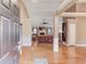 Open concept living room featuring a fireplace, hardwood floors, and a high ceiling at 4235 Crestwood Bend Cir, Buford, GA 30518