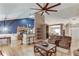 Inviting living room featuring hardwood floors, a ceiling fan, and an open floor plan with seamless flow at 4235 Crestwood Bend Cir, Buford, GA 30518