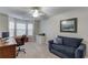 Bright office space includes a comfy couch and work area at 4235 Crestwood Bend Cir, Buford, GA 30518