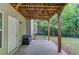 Covered patio with a porch swing and a view of the backyard at 4235 Crestwood Bend Cir, Buford, GA 30518