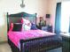 Cozy bedroom with cute decor, a comfortable bed, and a side table with a lamp at 4561 Olde Perimeter Way # 608, Dunwoody, GA 30346