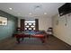 Spacious billiards room with a pool table, TV, and comfortable seating, perfect for entertaining guests and recreation at 4561 Olde Perimeter Way # 608, Dunwoody, GA 30346