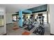 Well-equipped gym with modern equipment, fitness machines, weights, and mirrored walls, promoting a healthy lifestyle at 4561 Olde Perimeter Way # 608, Dunwoody, GA 30346