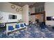 Lobby with wet bar, modern lighting, TV, and seating at 4561 Olde Perimeter Way # 608, Dunwoody, GA 30346