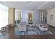 Contemporary lobby area with hardwood floors, modern furniture, and a large mirror at 4561 Olde Perimeter Way # 608, Dunwoody, GA 30346