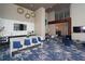 A stylish lounge area showcases a breakfast bar, modern lighting, and comfortable seating for social gatherings at 4561 Olde Perimeter Way # 608, Dunwoody, GA 30346