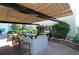 Outdoor kitchen features a bar, grill, and privacy landscaping at 4561 Olde Perimeter Way # 608, Dunwoody, GA 30346
