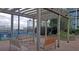 Relaxing outdoor lounge with wood pergola, seating, and manicured landscaping at 4561 Olde Perimeter Way # 608, Dunwoody, GA 30346