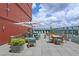 Stunning rooftop deck with ample seating, umbrellas, and panoramic city views, creating an upscale outdoor experience at 4561 Olde Perimeter Way # 608, Dunwoody, GA 30346