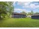 A spacious backyard with grass and a detached garage at 160 Northside Ave, Dallas, GA 30157
