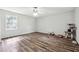 Spacious bedroom with wood-look floors, a large window for natural light, and a versatile layout at 160 Northside Ave, Dallas, GA 30157