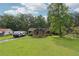 Quaint home with a welcoming front porch, situated on a spacious lot with mature trees and a green lawn at 160 Northside Ave, Dallas, GA 30157