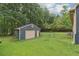 A detached, single-car garage with garage door and fenced yard at 160 Northside Ave, Dallas, GA 30157