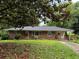 Charming red brick ranch-style home with covered parking and a well-maintained front yard at 1791 Fairview Sw Dr, Austell, GA 30106