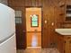 View from the kitchen through the doorway to the dining room shows hardwood floors and a chandelier at 1791 Fairview Sw Dr, Austell, GA 30106