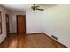 Bright living room featuring hardwood floors, white walls, and two doorways at 1791 Fairview Sw Dr, Austell, GA 30106