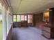 Enclosed porch featuring brick wall, large windows, and indoor-outdoor carpeting at 1791 Fairview Sw Dr, Austell, GA 30106