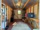 Storage shed features a metal roof, wooden beams, and a small window at 1791 Fairview Sw Dr, Austell, GA 30106