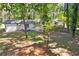 Expansive backyard featuring a well-maintained lawn and white brick home exterior at 2595 Elkhorn Dr, Decatur, GA 30034