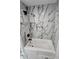 Close up on tub with marble tile surround at 2595 Elkhorn Dr, Decatur, GA 30034