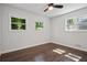 Bedroom with hardwood flooring and natural light from three windows at 2595 Elkhorn Dr, Decatur, GA 30034