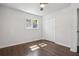 Bright bedroom with hardwood floors, ceiling fan, a window, and closet at 2595 Elkhorn Dr, Decatur, GA 30034