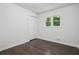 Bedroom featuring a window, closet, and light gray wall paint at 2595 Elkhorn Dr, Decatur, GA 30034
