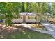 Charming home with a modern front door, covered carport, and fresh landscaping at 2595 Elkhorn Dr, Decatur, GA 30034