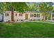 Charming one story home with a freshly manicured lawn and painted brick exterior at 2595 Elkhorn Dr, Decatur, GA 30034