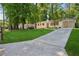 Charming one story home with a freshly manicured lawn, long driveway, and painted brick exterior at 2595 Elkhorn Dr, Decatur, GA 30034