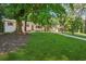 Well manicured one story home with white painted brick and a single car carport at 2595 Elkhorn Dr, Decatur, GA 30034