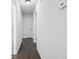 Hallway with hardwood floors and neutral walls leading to multiple rooms in the home at 2595 Elkhorn Dr, Decatur, GA 30034