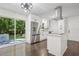 Modern kitchen featuring stainless steel appliances, a center island, and sliding glass doors to the outdoor space at 2595 Elkhorn Dr, Decatur, GA 30034