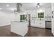 Modern kitchen with white cabinets, stainless steel appliances, and a functional center island at 2595 Elkhorn Dr, Decatur, GA 30034