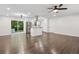 Bright and open concept kitchen and living space with hardwood floors, stainless appliances, and recessed lighting at 2595 Elkhorn Dr, Decatur, GA 30034