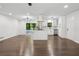 Bright and open concept kitchen and living space with hardwood floors and stainless appliances at 2595 Elkhorn Dr, Decatur, GA 30034