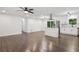 Bright and open concept kitchen and living space with hardwood floors, ceiling fan and recessed lighting at 2595 Elkhorn Dr, Decatur, GA 30034