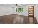 Spacious living room with hardwood floors and a front door with modern design elements at 2595 Elkhorn Dr, Decatur, GA 30034