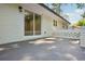 White brick patio with sliding glass door and privacy wall, perfect for outdoor relaxation at 2595 Elkhorn Dr, Decatur, GA 30034
