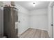 Clean and functional utility room with vinyl flooring and shelving at 2595 Elkhorn Dr, Decatur, GA 30034