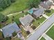A beautiful neighborhood with manicured lawns, mature trees, and a sparkling community pool at 580 River Valley Dr, Dacula, GA 30019