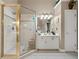 Bathroom showcasing a glass-enclosed shower and single vanity sink at 580 River Valley Dr, Dacula, GA 30019