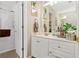 Bathroom featuring a white vanity with decorative items and a glass-enclosed shower at 580 River Valley Dr, Dacula, GA 30019