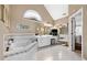 This spacious bathroom has a soaking tub, dual sinks, and white tile floors at 580 River Valley Dr, Dacula, GA 30019