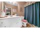 Bathroom featuring a vanity with white cabinets and a blue shower curtain at 580 River Valley Dr, Dacula, GA 30019