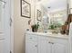Bright bathroom with white vanity, mirror, and functional layout, offering a refreshing space for personal care at 580 River Valley Dr, Dacula, GA 30019