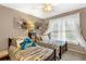 Bedroom featuring two twin beds with a plush toy and soft decor at 580 River Valley Dr, Dacula, GA 30019